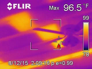Infrared thermal scan revealing missing insulation in a wall cavity during a building inspection